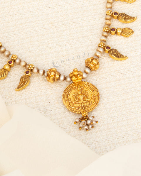 Antique Gold Polish Threaded Necklace With Mango Leaf Motifs And Lakshmi Coin Pendant