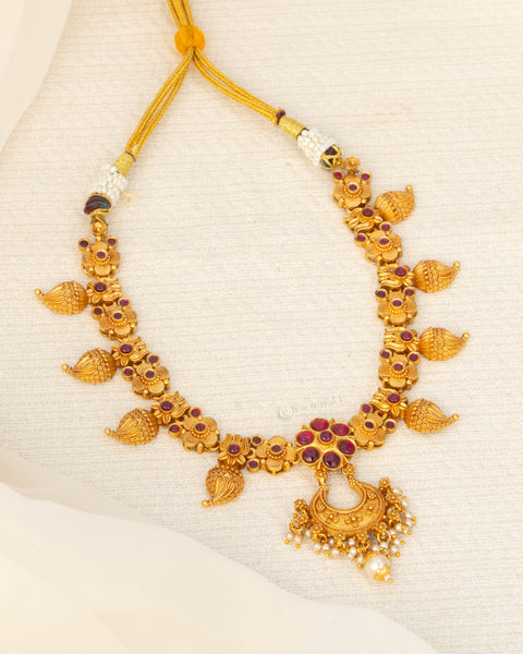 Antique Gold Polish Necklace With Mango And Kemp Ruby Floral Motifs, Chandbali Pendant And Pearl Drops