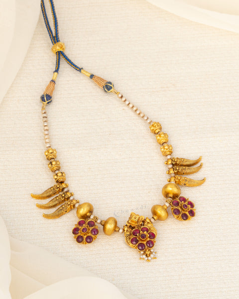Antique Gold Polish Threaded Necklace With Mango Leaf Motifs And Multiple Kemp Ruby Flower Pendants